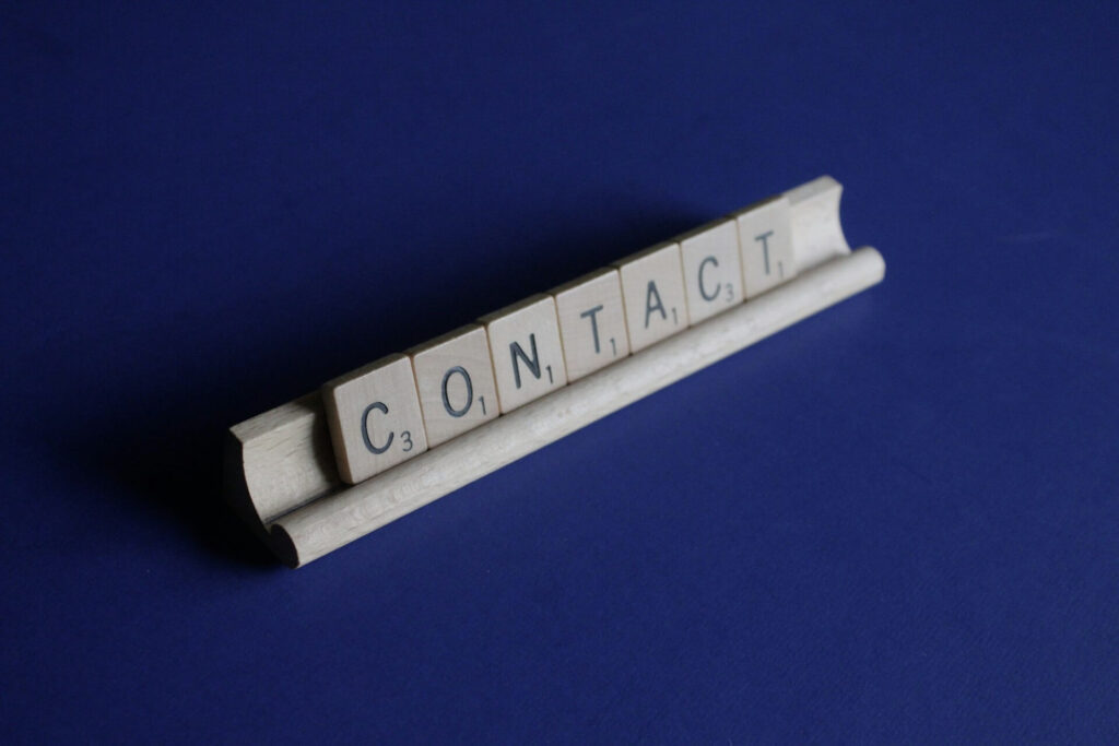 Contact written using scrabble letters